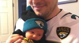Mike Tiscione with his daughter, and new Jaguars fan, Aria.