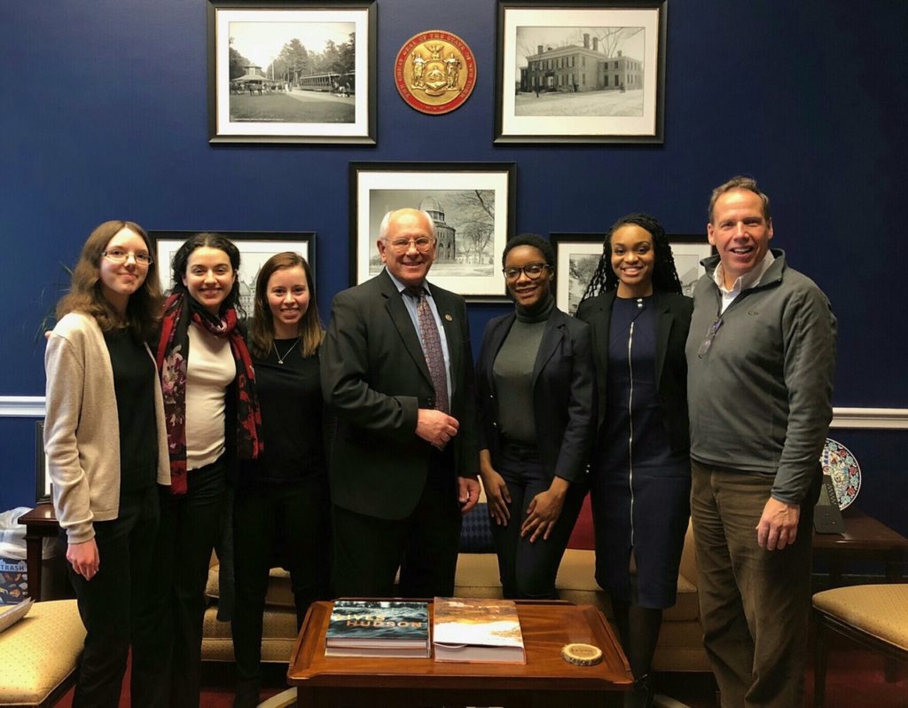 Saint Rose students standing with Congressman Paul Tonko in his Washington, D.C. office during their Winter Break service trip.