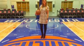 Erin Felix standing on the basketball court of the Westchester Knicks