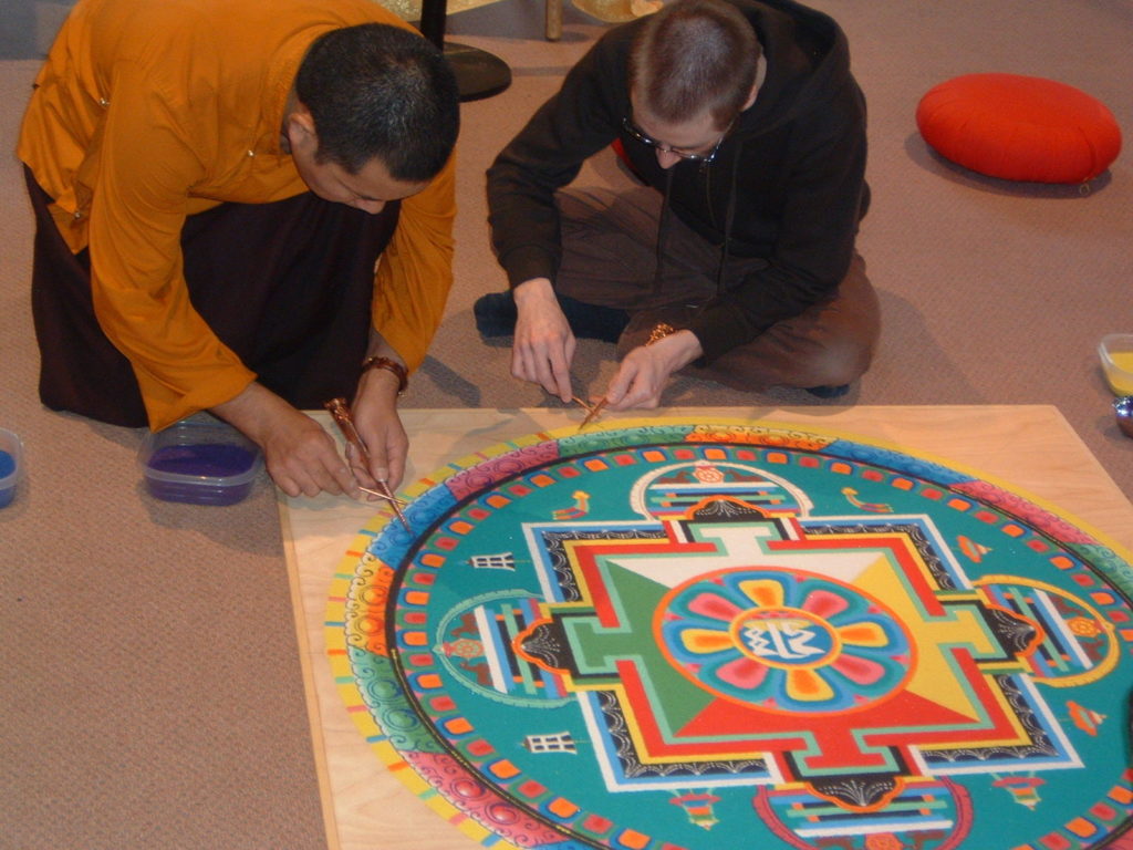 Lama Karma Chopal makes mandala in 2010 at Saint Rose