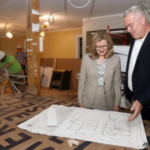 Saint Rose President Carolyn J. Stefanco looks at plans with the architect in the Michelle Cuozzo Borisenok '80 House