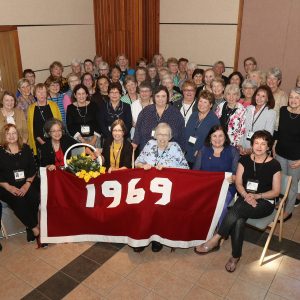 Saint Rose Class of 1969 group photo with 1969 banner