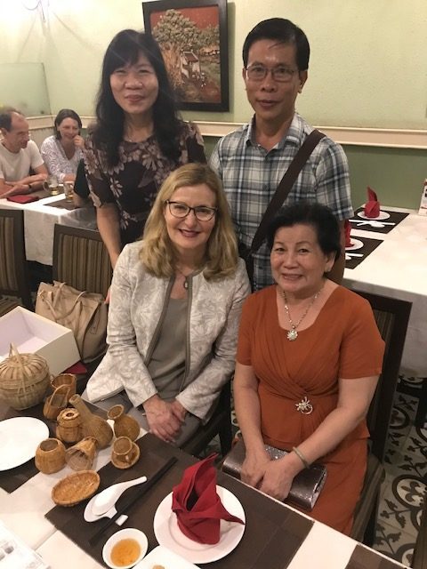 President Carolyn J. Stefanco with the family of a current Saint Rose student in Vietnam