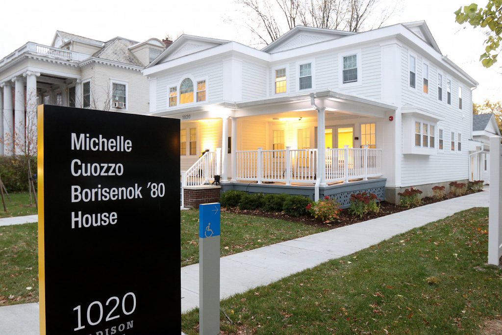 exterior of the Michelle Cuozzo Borisenok '80 House with sign bearing the house's name in foreground