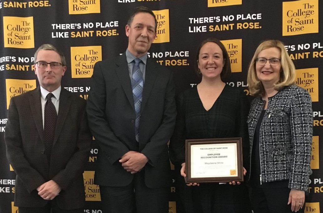 Award recipient Magdalene White, assistant director of graduate admissions, with nominator Daniel Gallagher, assistant vice president for graduate admissions; Jeffrey Knapp, associate vice president for human resources and risk management, and Saint Rose President Carolyn J. Stefanco.