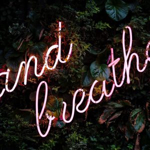 Picture of a sign, stating 'and breathe'