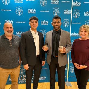 Anthony Barone-Lopez, shown center left, and Harshad Udaya Kumar, shown center right, competed in the NISC competition recently at Bryant University. They are shown with coaches John Dion and Kristen Delaney