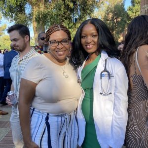 Hellen Jumo '20 earlier this fall during the white coat ceremony marking her start at the David Geffen School of Medicine at University of California at Los Angeles. With her is Yolanda Caldwell, director of the BOLD Women's Leadership Institute at Saint Rose, and a mentor, who traveled across the country to celebrate the occasion with Jumo.